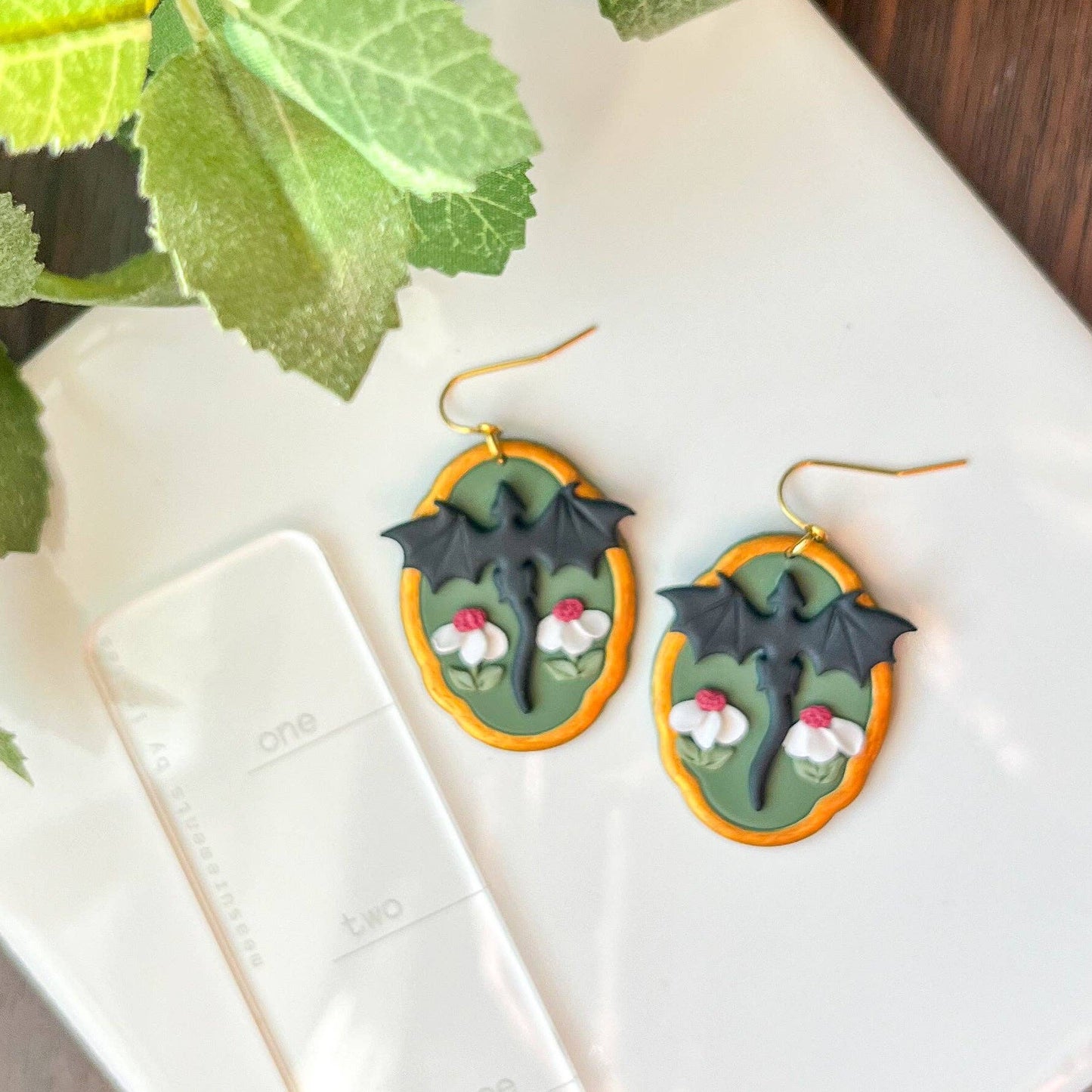 Earrings - Black framed dragon