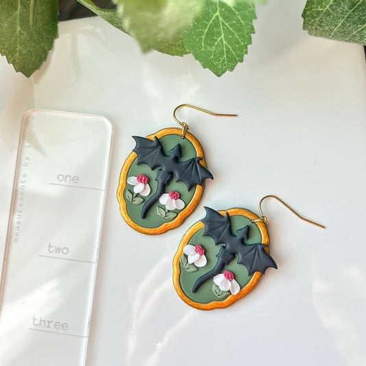 Earrings - Black framed dragon