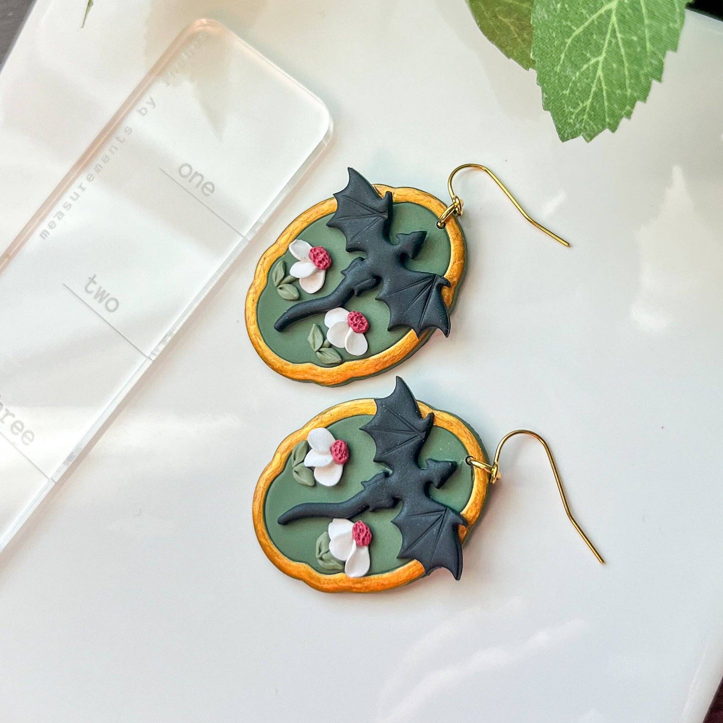 Earrings - Black framed dragon